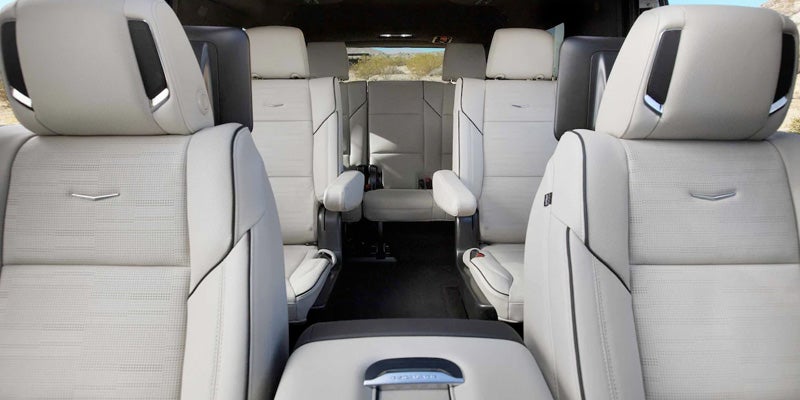 Cadillac Escalade interior rows of chairs