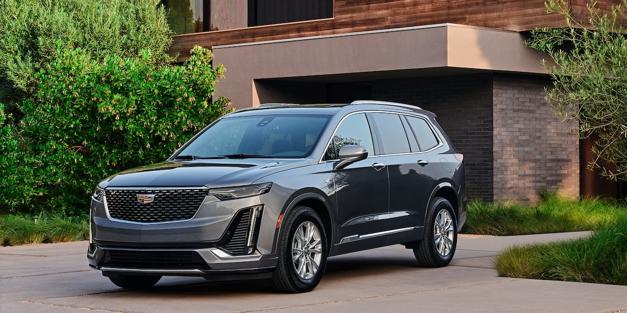 2022 Cadillac XT6 parked outside a modern house