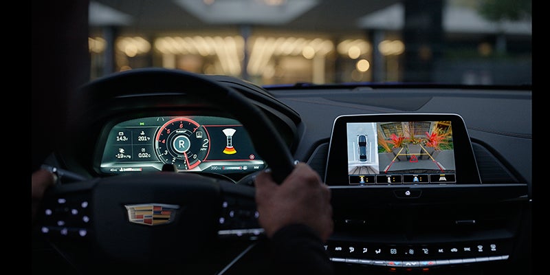 Brand new Cadillac CT4-V interior design as someone is using their back up camera to park
