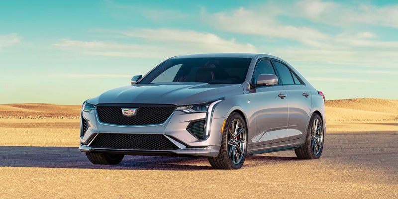 Cadillac CT5 parked outside near a garage during the sun set